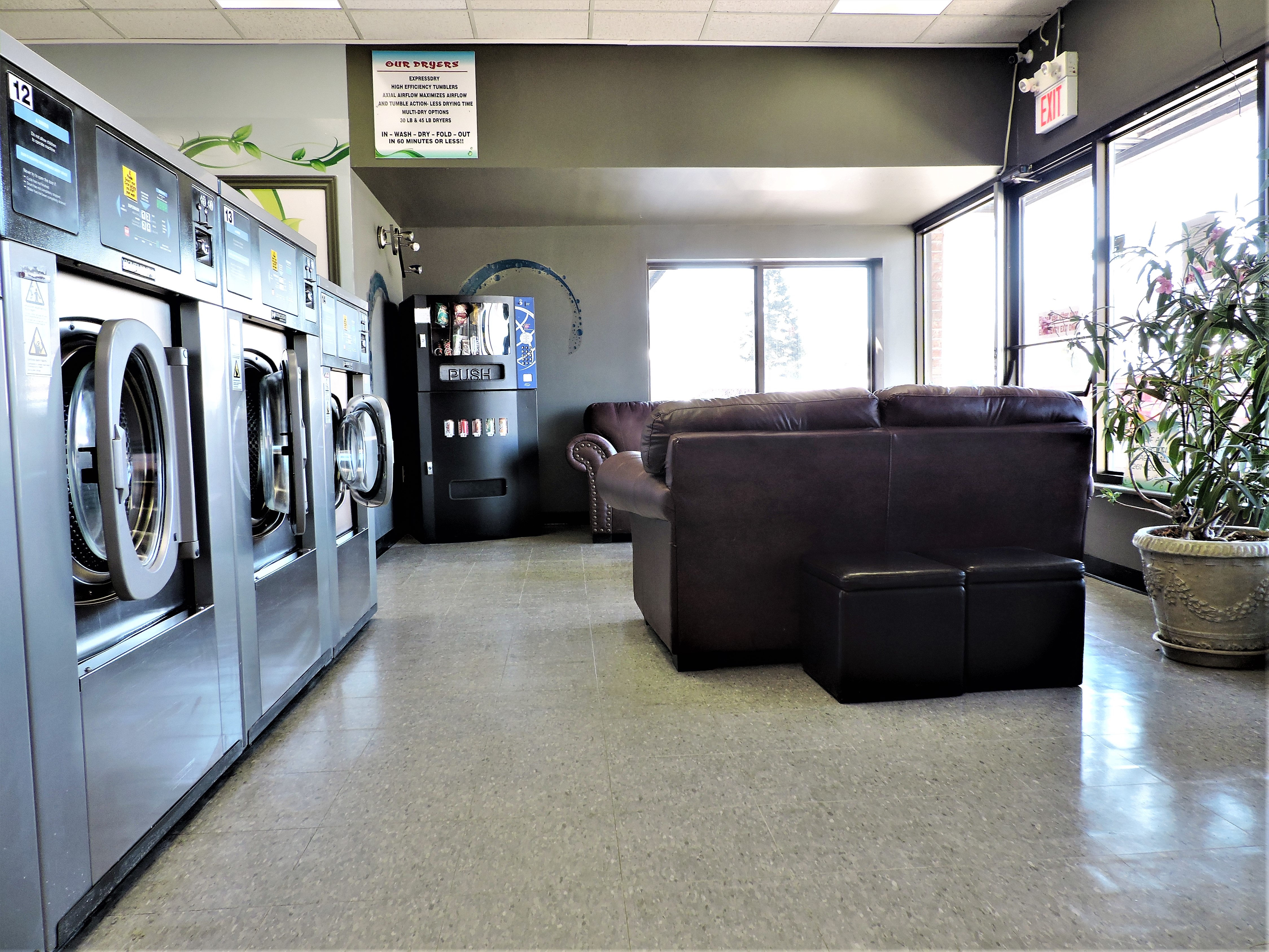 Relax while you wait: stocked vending machine, comfy couches, & TV